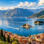 Panoramic view of Boka Bay, Montenegro, with Kotor Old Town, historic islands and dramatic mountains